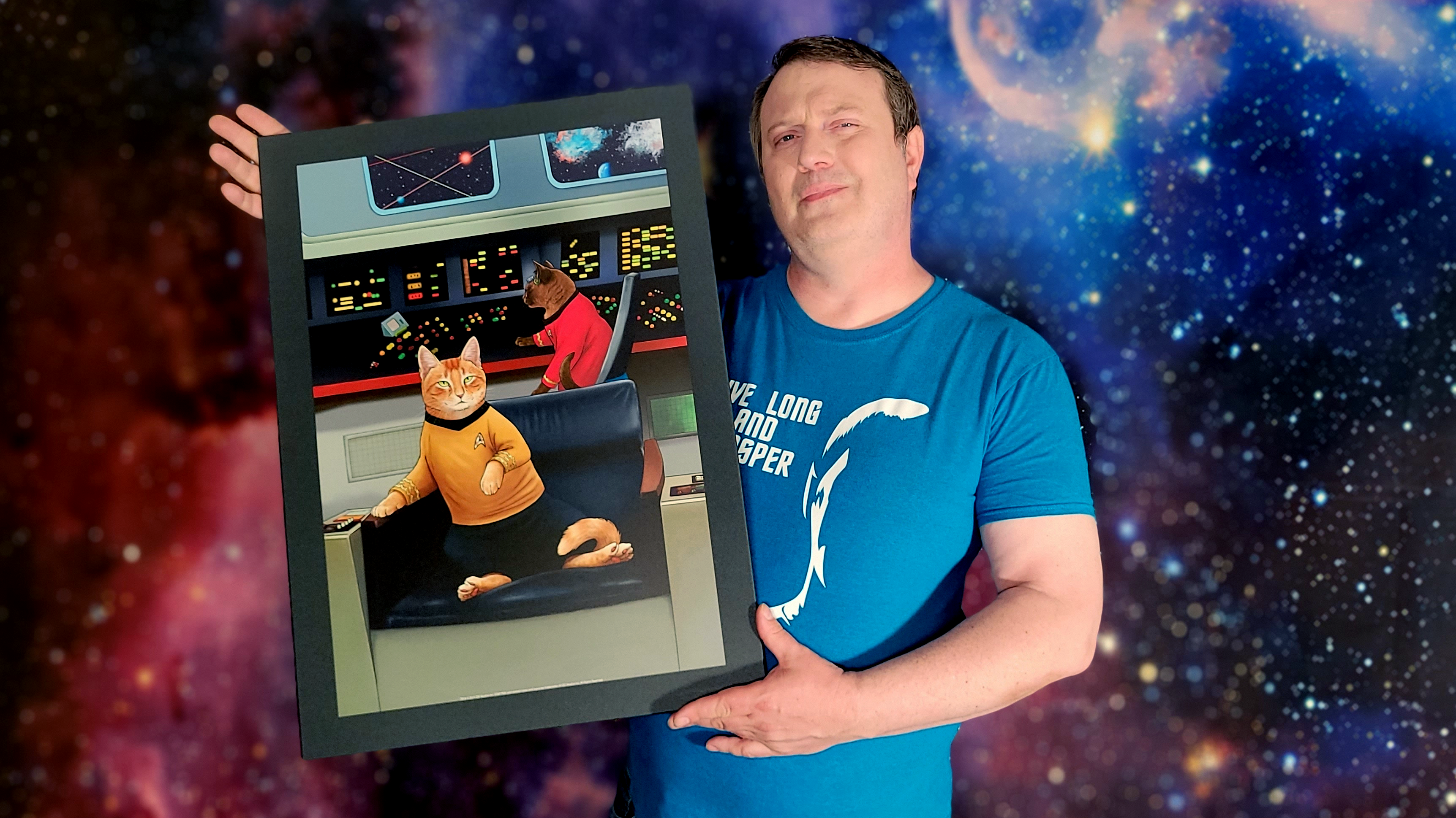 Captain Kyle holding a Displate poster of cats as Star Trek characters